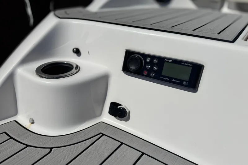 Slide: The Image of Yamaha Boats 2022 model 212 dashboard with Fusion stereo and cup holder. - 8