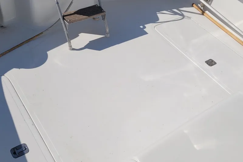 Slide: The Image of Deck of 2002 SeaTek 36 Express boat with ladder and clean surface. - 34