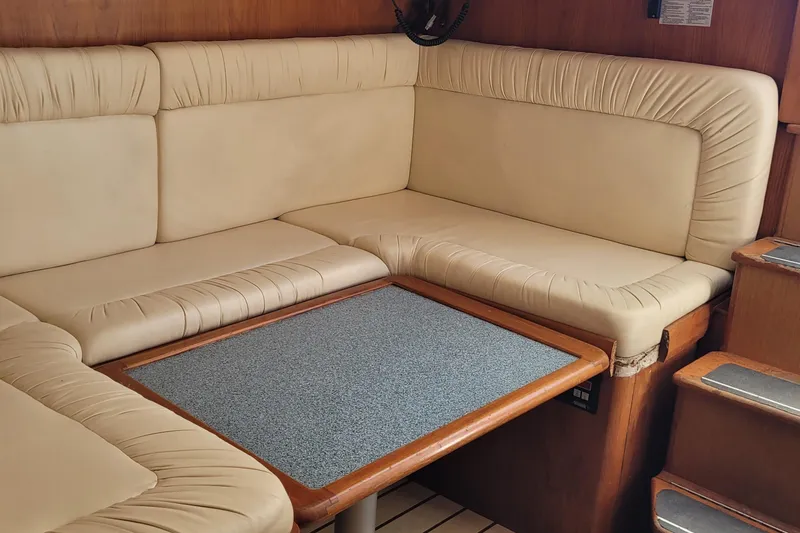 Slide: The Image of Luxurious beige seating area in 2002 SeaTek 36 Express yacht interior. - 41