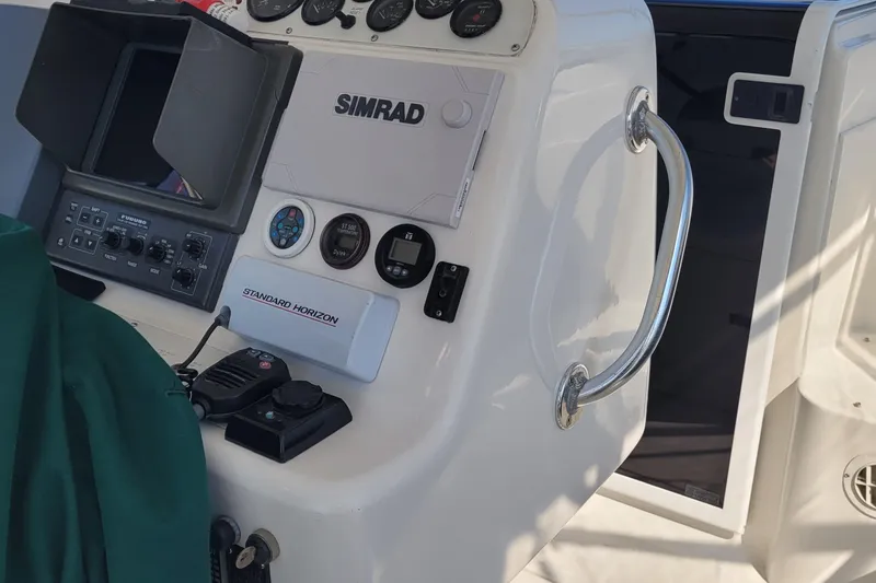 Slide: The Image of Control panel of 2002 SeaTek 36 Express boat with navigation equipment. - 45