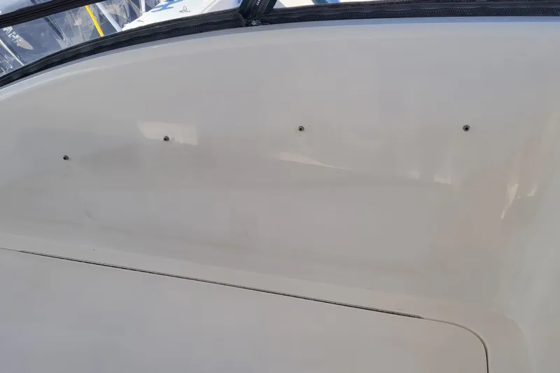 Slide: The Image of Side view of a 2002 SeaTek 36 Express boat, showcasing its sleek white exterior. - 50