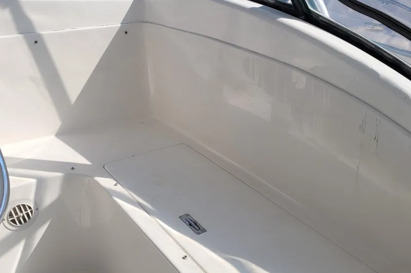 Slide: The Image of Interior view of a 2002 SeaTek 36 Express boat, showcasing clean white surfaces. - 51
