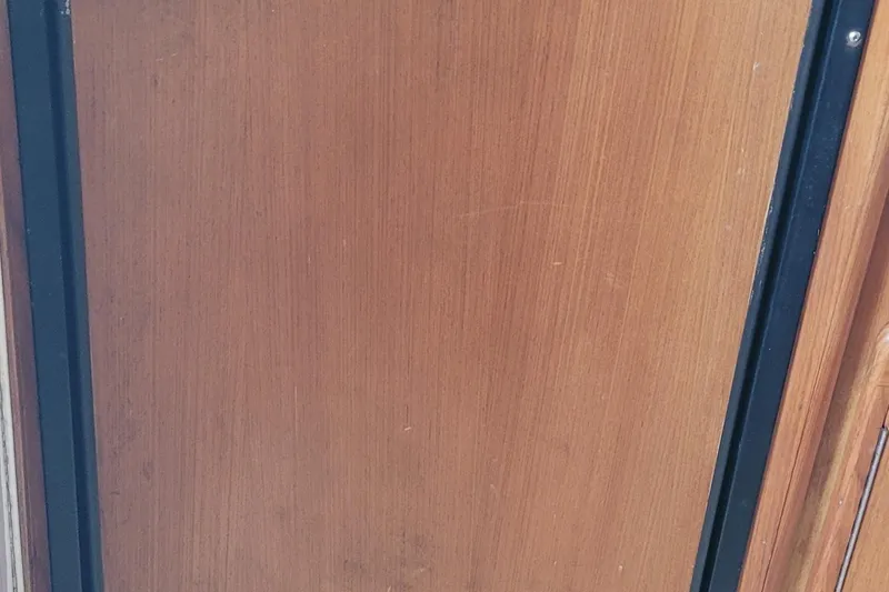 Slide: The Image of Wooden panel detail from a 2002 SeaTek 36 Express boat interior. - 55