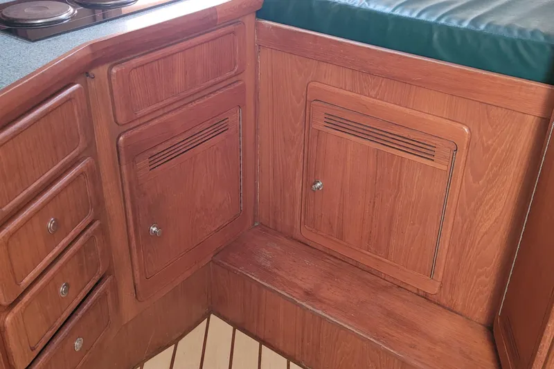 Slide: The Image of Wooden interior of 2002 SeaTek 36 Express boat with cabinets and seating. - 56
