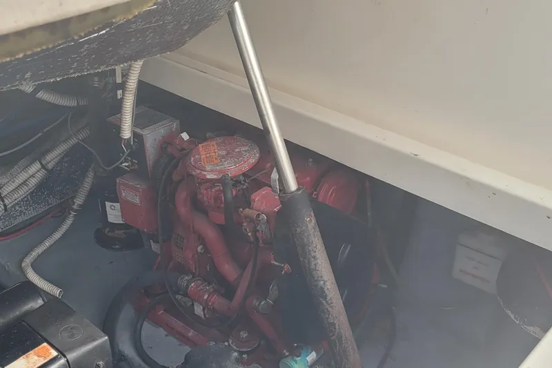 Slide: The Image of Engine compartment of a 2002 SeaTek 36 Express boat, showing mechanical components and wiring. - 70