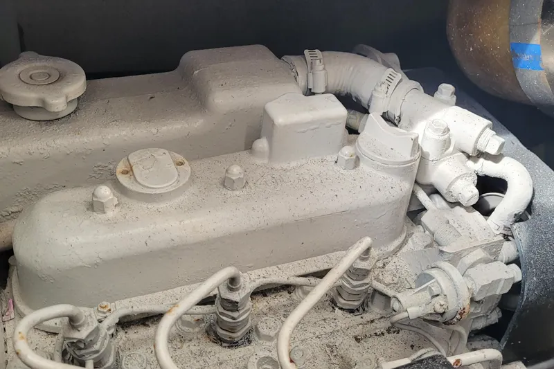 Slide: The Image of Engine compartment of a 2002 SeaTek 36 Express boat, showing detailed mechanical components. - 74