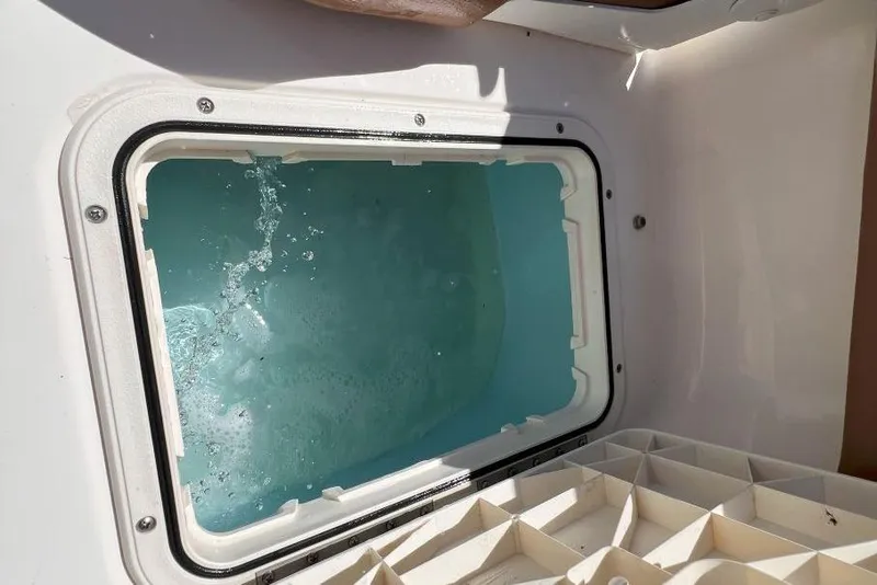 Slide: The Image of Livewell on 2022 Pioneer 202 Islander boat, filled with water. - 13