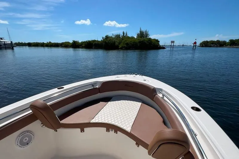Slide: The Image of 2022 Pioneer 202 Islander boat on calm water with scenic island view. - 5