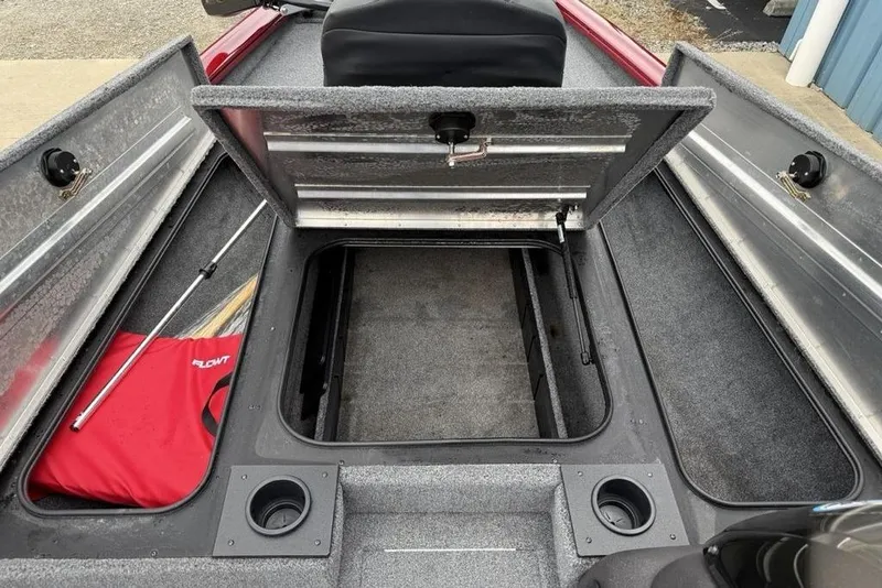 Slide: The Image of 2024 Tracker Pro Team 175 TXW® boat storage compartments with open hatches and cup holders. - 12
