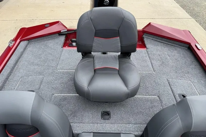 Slide: The Image of 2024 Tracker Pro Team 175 TXW® boat interior with gray seating and red accents. - 17