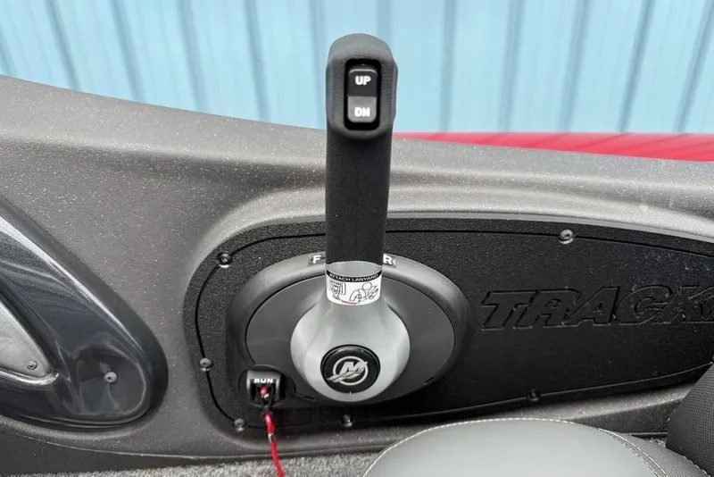 Slide: The Image of 2024 Tracker Pro Team 175 TXW® boat control lever with "UP" and "DN" buttons. - 18