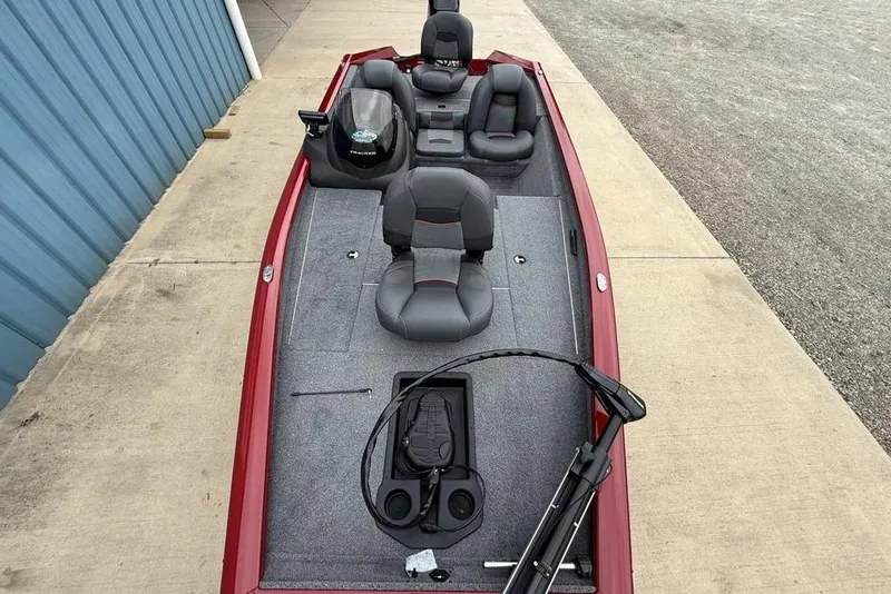 Slide: The Image of 2024 Tracker Pro Team 175 TXW® fishing boat with gray seating and red exterior. - 19