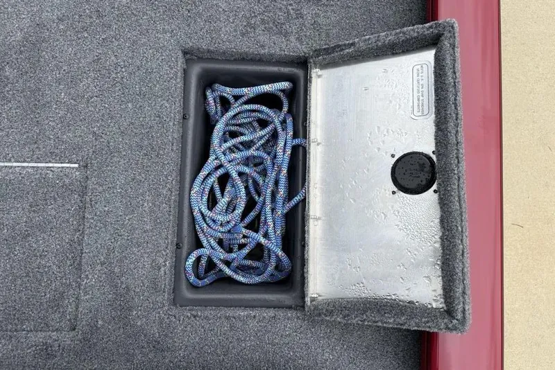 Slide: The Image of Open storage compartment with rope in 2024 Tracker Pro Team 175 TXW® boat. - 20