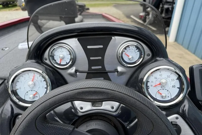 Slide: The Image of Dashboard of 2024 Tracker Pro Team 175 TXW® boat with gauges and steering wheel. - 6