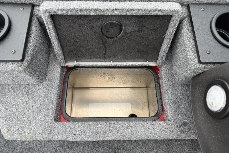 Slide: The Image of 2024 Tracker Pro Team 175 TXW® boat storage compartment with open lid, gray interior. - 7