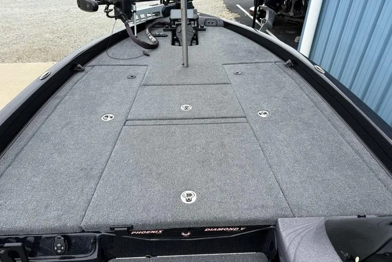 Slide: The Image of 2019 Phoenix 921 PRO XP boat deck with gray carpet and storage compartments. - 11