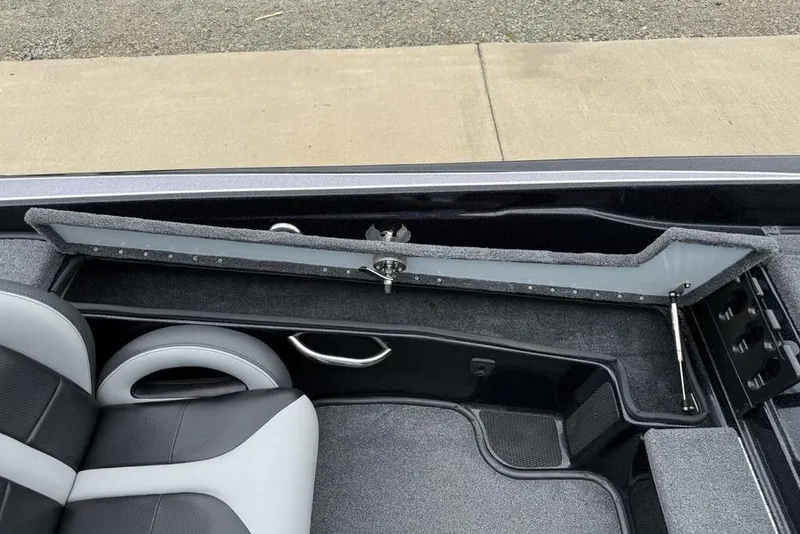 Slide: The Image of 2019 Phoenix 921 PRO XP boat interior with open storage compartment. - 16