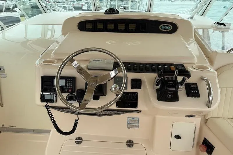 Slide: The Image of 2008 Grady-White Express 360 helm with steering wheel and control panel. - 11