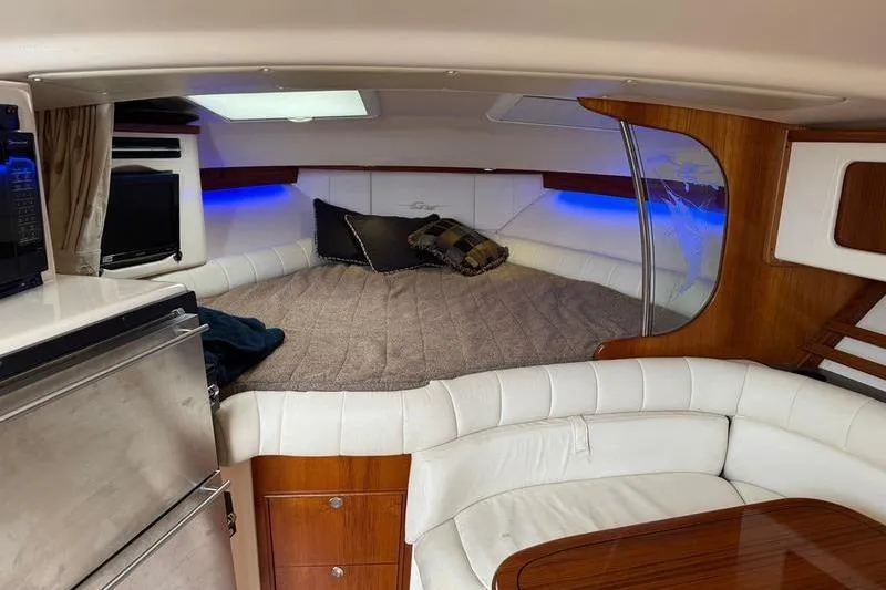 Slide: The Image of 2008 Grady-White Express 360 cabin interior with cozy bed and modern amenities. - 17