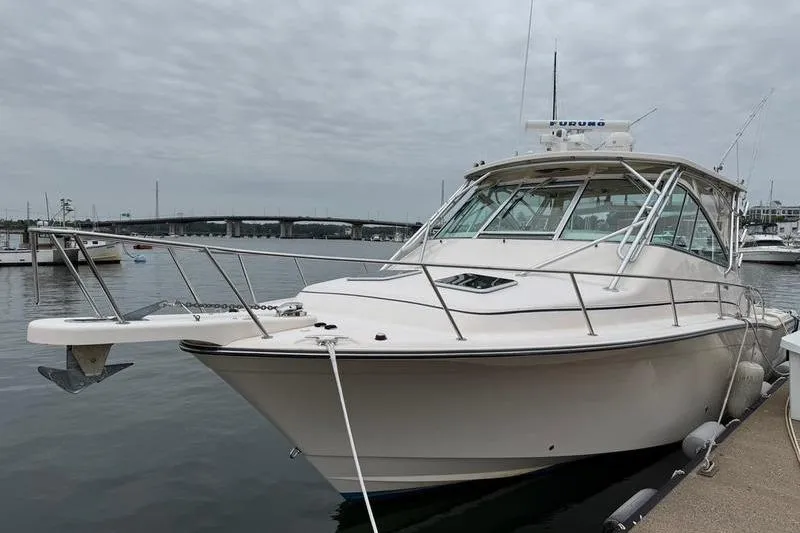 Slide: The Image of 2008 Grady-White Express 360 boat docked in a marina under cloudy skies. - 20