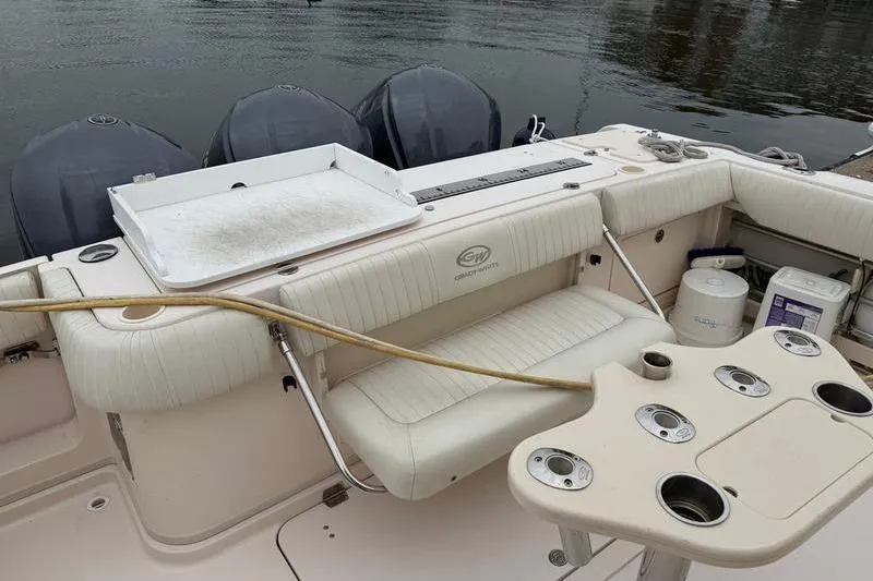Slide: The Image of 2008 Grady-White Express 360 boat interior with seating and fishing rod holders. - 3