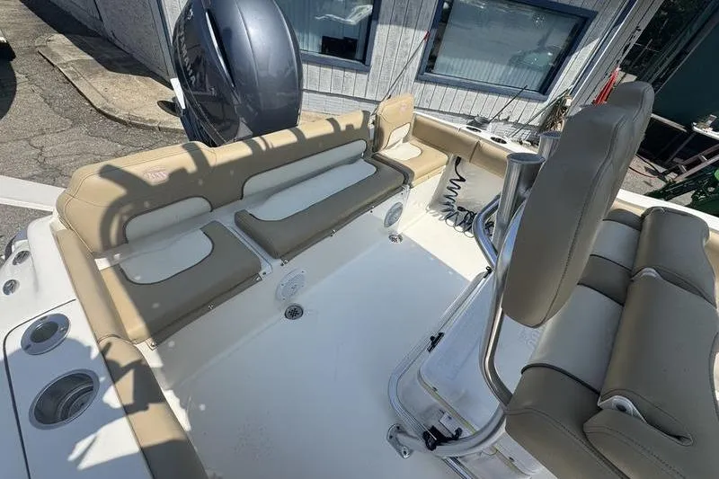 Slide: The Image of 2019 Key West 219fs boat interior with beige seating and modern design. - 12
