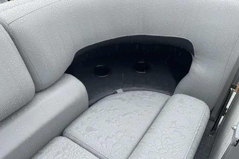 Slide: The Image of 2026 Sun Tracker PB 20 DLX boat seat with raindrops and cup holders. - 12