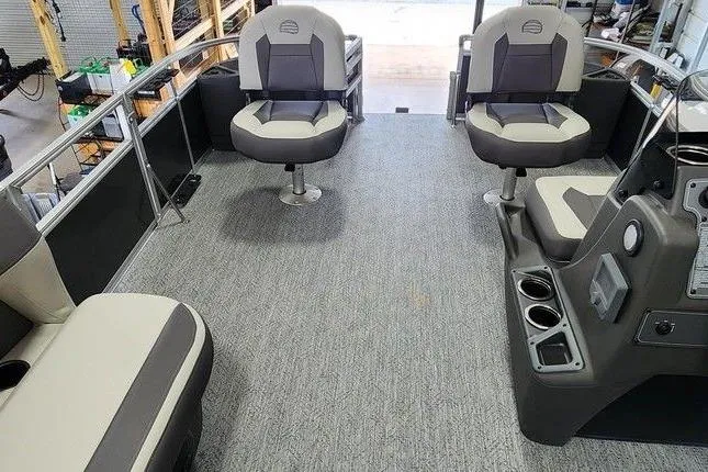 The Image of Interior of 2026 Sun Tracker BASS BUGGY® 18 DLX pontoon boat with seating and console. - 1
