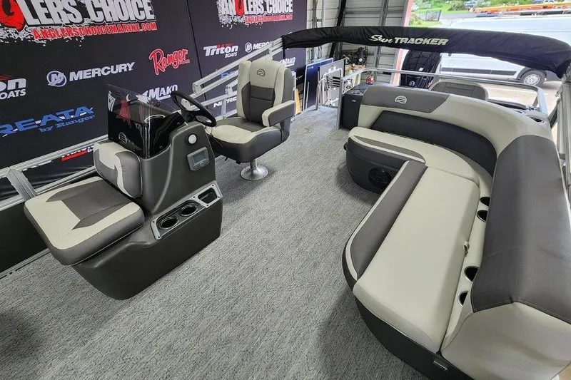 Slide: The Image of 2026 Sun Tracker BASS BUGGY® 18 DLX interior with seating and steering console. - 9