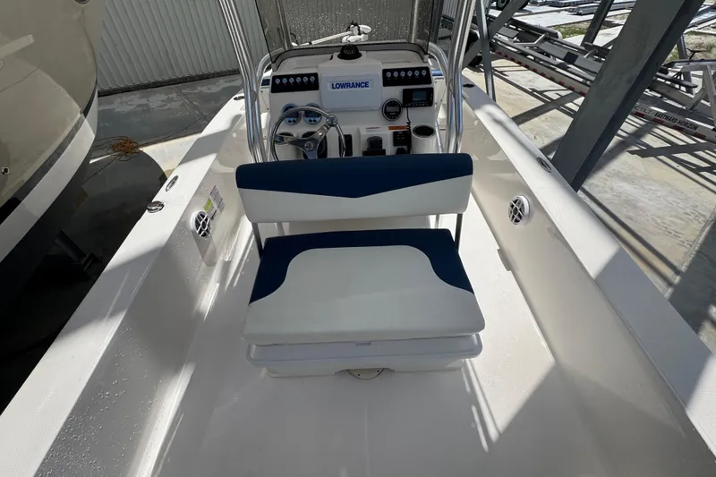 Slide: The Image of 2022 Robalo 206 Cayman boat interior with steering console and seating. - 16