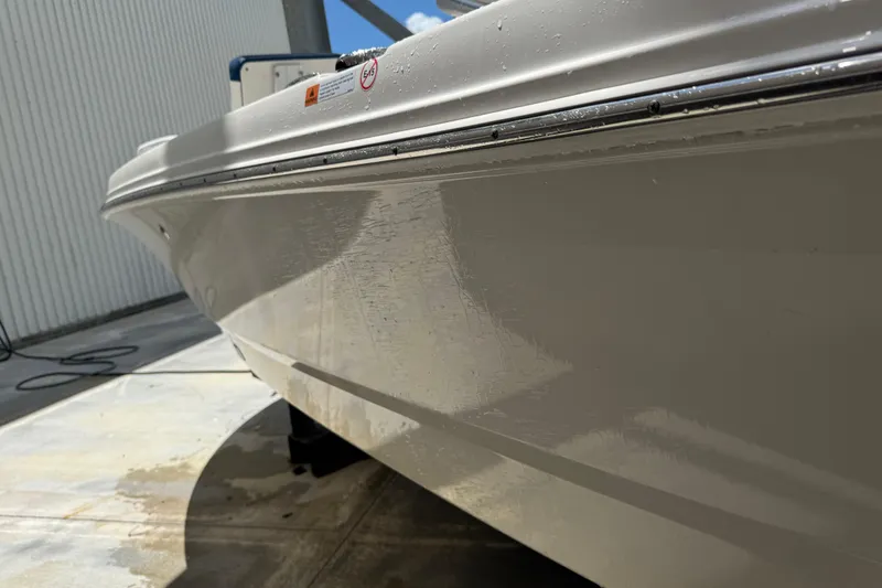 Slide: The Image of 2022 Robalo 206 Cayman boat hull, close-up view, showcasing sleek design and craftsmanship. - 23