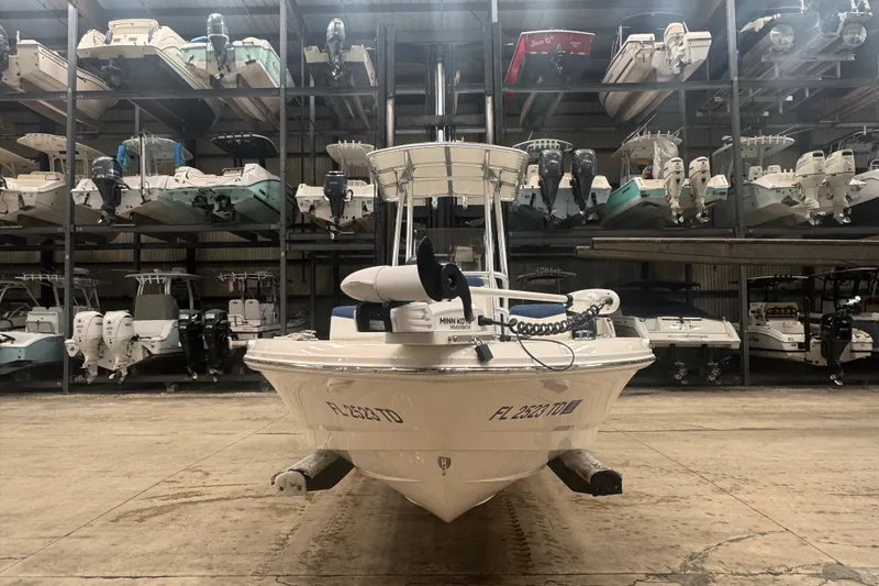 Slide: The Image of 2022 Robalo 206 Cayman boat in storage facility with multiple boats on racks. - 3