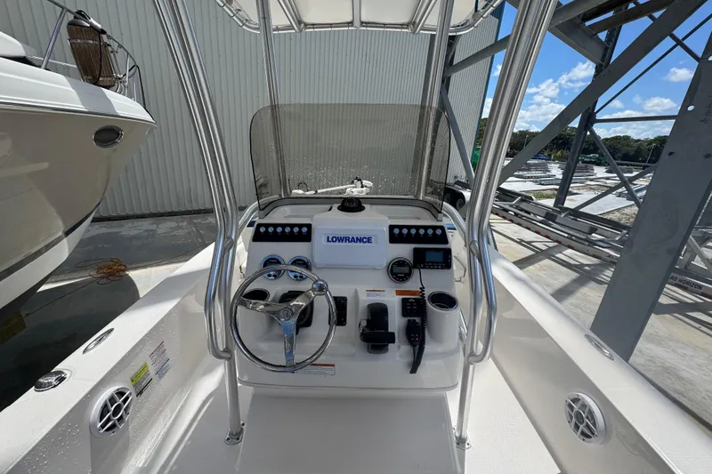 Slide: The Image of 2022 Robalo 206 Cayman boat console with steering wheel and navigation equipment. - 4