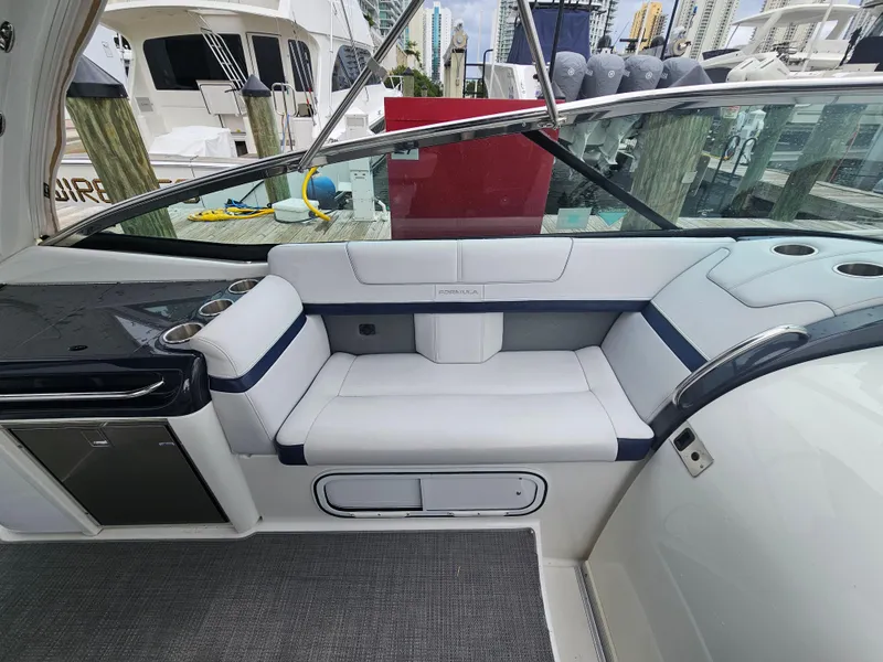 Slide: The Image of 2018 Formula 350 Sun Sport boat interior with white seating and sleek design. - 16