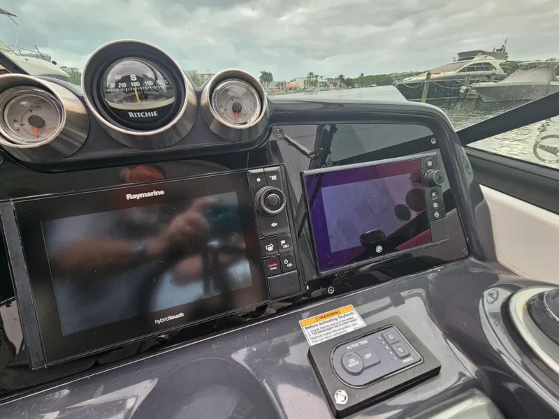 Slide: The Image of 2018 Formula 350 Sun Sport dashboard with navigation screens and gauges. - 22