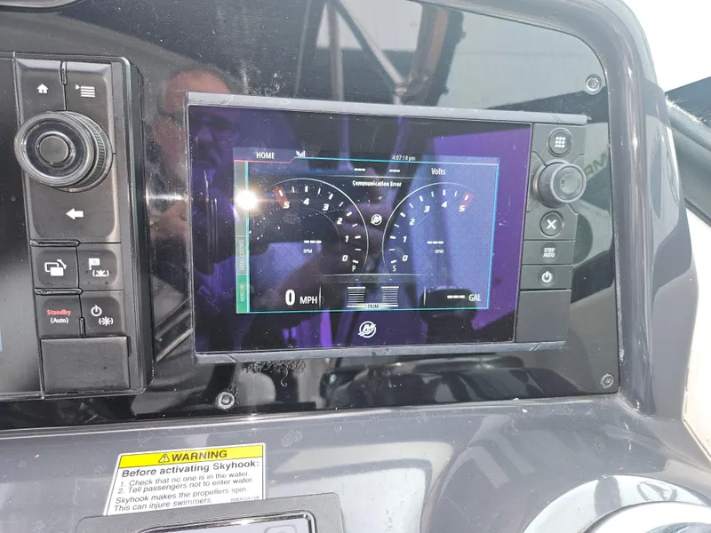 Slide: The Image of Dashboard of a 2018 Formula 350 Sun Sport boat with digital display and controls. - 29