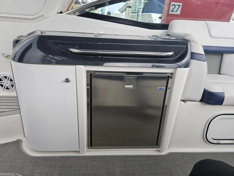 Slide: The Image of 2018 Formula 350 Sun Sport interior with stainless steel mini-fridge and seating. - 34