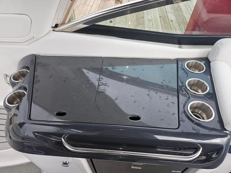 Slide: The Image of 2018 Formula 350 Sun Sport boat interior with wet bar and cup holders. - 36