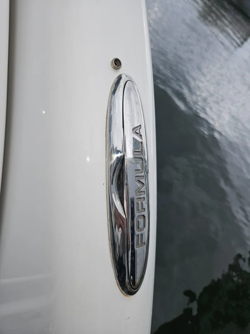 Slide: The Image of Close-up of 2018 Formula 350 Sun Sport boat emblem near water. - 39