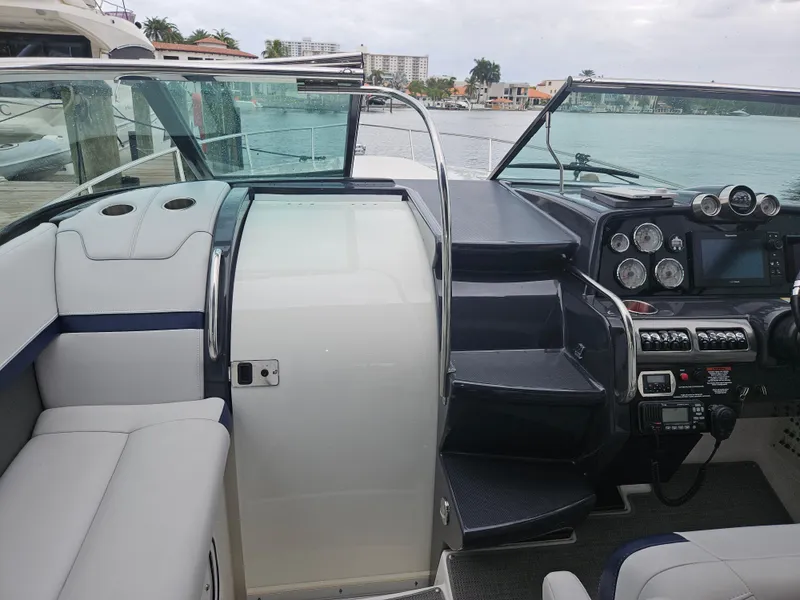 Slide: The Image of 2018 Formula 350 Sun Sport boat interior with modern dashboard and seating. - 40