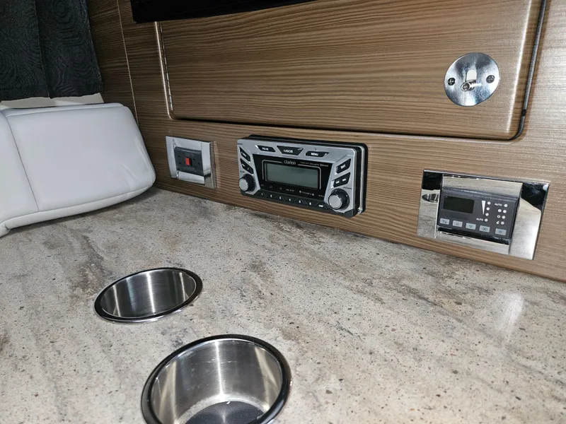 Slide: The Image of Interior of 2018 Formula 350 Sun Sport with control panel and cup holders. - 47