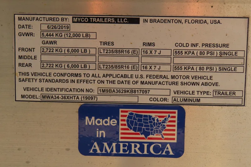 Slide: The Image of Trailer specification label by Myco Trailers, LLC, featuring weight, tire, and pressure details. - 12