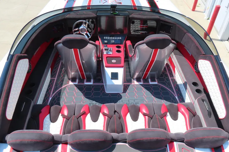 Slide: The Image of 2018 Wright Performance 360 boat interior with red and gray seating, modern dashboard, and stylish design. - 16