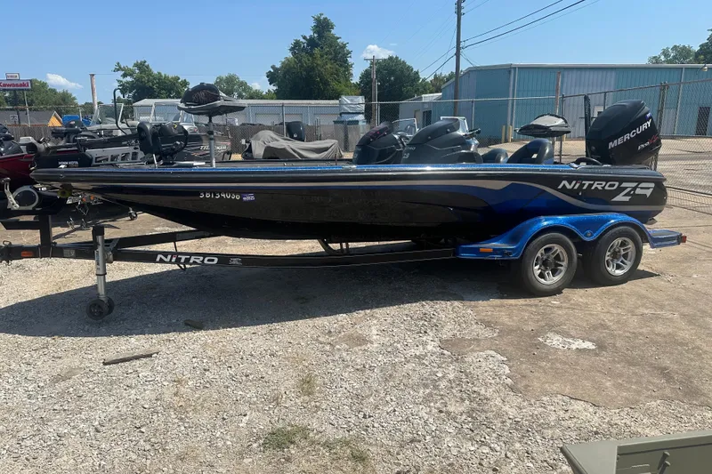 The Image of 2012 Nitro Z-9 boat with Mercury engine on trailer, parked outdoors. - 0