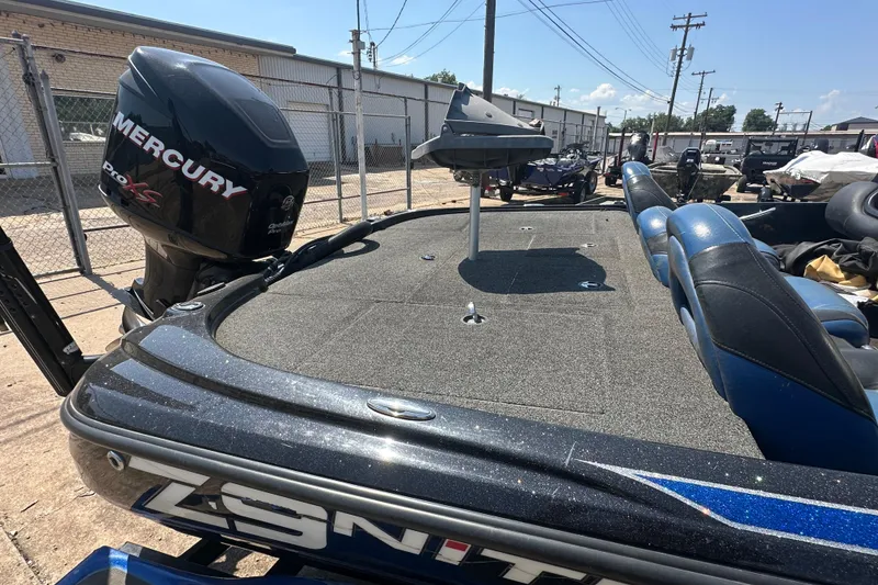 Slide: The Image of 2012 Nitro Z-9 boat with Mercury Pro XS engine, parked outdoors. - 12