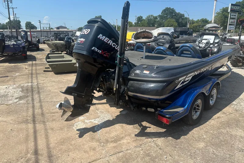 Slide: The Image of 2012 Nitro Z-9 boat with Mercury Pro XS engine in outdoor dealership lot. - 4