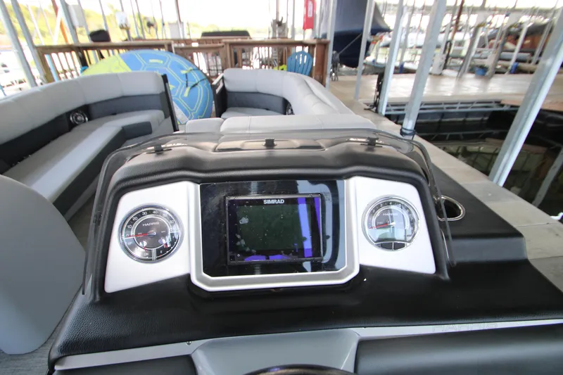 Slide: The Image of 2020 Harris FloteBote Solstice 250 SL dashboard with navigation display and gauges. - 12