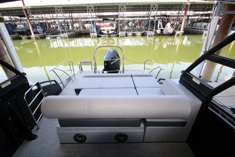 Slide: The Image of 2020 Harris FloteBote Solstice 250 SL pontoon boat with spacious seating at marina. - 13