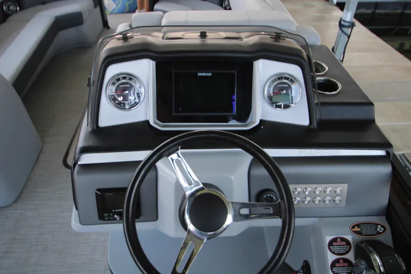 Slide: The Image of 2020 Harris FloteBote Solstice 250 SL boat dashboard with steering wheel and gauges. - 20