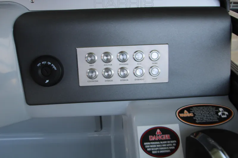 Slide: The Image of Control panel of 2020 Harris FloteBote Solstice 250 SL with labeled buttons and warnings. - 23